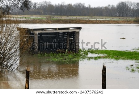 Shelter or Shed for Animal Feed in a Flooded Field during Persistent Rainfall