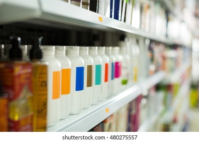 Shelves With Different Hair Care Products In Beauty Salon 