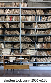 Shelves Full Of Files In A Messy Old-fashioned Archive