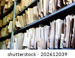 shelves full of files in an old archive