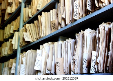 shelves full of files in an old archive - Shutterstock ID 202612039