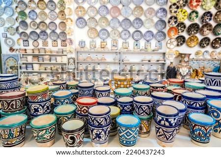 Shelves full of handmade ceramic products in pottery factory in Fez, Morocco, North Africa