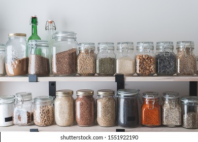 Shelves With Glass Jars Filled With Groceries. Concept Of Zero Waste Home And Lifestyle