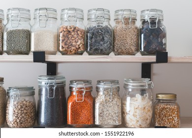 Shelves With Glass Jars Filled With Groceries. Concept Of Zero Waste Home And Lifestyle