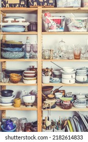 Shelves With Kitchen Clutter, Utensils And Kitchenware. Concept Of Tidying And Decluttering