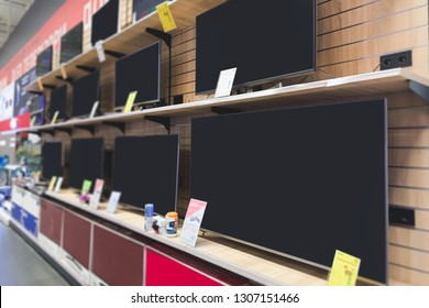 Shelves With TVs In The Technology Store. Choose And Buy A Modern TV In The Electronics Store. 4K TV Showcase In The Store