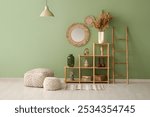 Shelving unit, poufs ladder and mirror in interior of living room