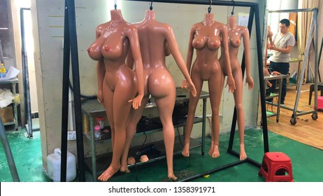 Shenzhen, China - 11.08.2018: Silicone TPE Female Sex Dolls Bodies Hanged In The Chinese Sex Toys Factory Workshop