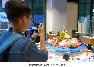 SHENZHEN, CHINA - CIRCA APRIL, 2019: Man Taking Photos In Sony Store At UpperHills During Sony Expo 2019.