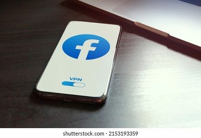 Shenzhen, China - MAY 03, 2022: Iphone Lying On A Wooden Table, On The Screen Facebook Social Application Logo, Which Starts Only After Turning On The Vpn Connection. Government Censorship Concept