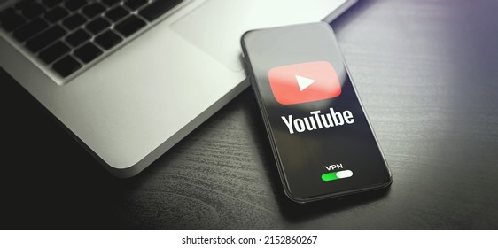 Shenzhen, China - MAY 04, 2022: Iphone Lying On A Wooden Table, On The Screen Youtube Video Application Logo, Which Open Only After Turning On The Vpn Connection. Government Censorship Concept