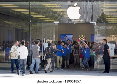 SHENZHEN, CHINA - NOV. 3:  Customers walking into the new Apple store. Apple open its seventh Apple store in mainland China, located in SHENZHEN, November 3, 2012.