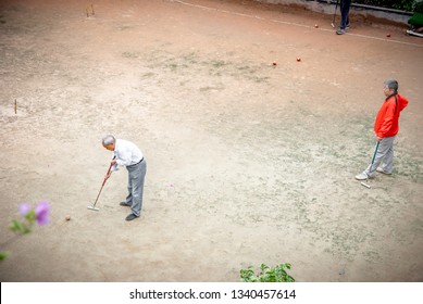 Shenzhen, China - September 2018: : Elderly People Playing Croquet In A Park With Friends. Activities For Older Chinese Generation. Asian Seniors Lifestyle