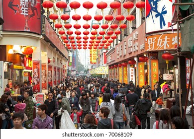 SHENZHEN, CHINA-JAN 27: Shoppers and visitors crowd the famous Dongmen Pedestrian Street on Jan 27, 2011 in Shenzhen, China, ahead of the upcoming Chinese New Year, the year of the rabbit.
