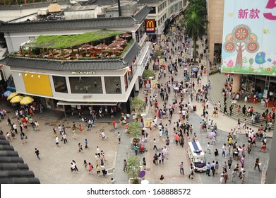 SHENZHEN, CHINA-MAY 27: Shoppers and visitors crowd the famous Dongmen Pedestrian Street on May 27, 2012 in Shenzhen, China. This city is regarded as one of the most successful Special Economic Zones.