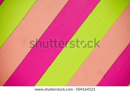 Shera wood paneling, green, purple, pink background.