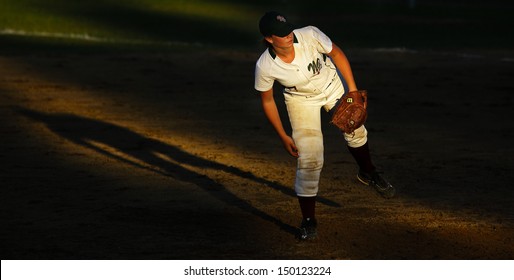 SHERBROOKE, CANADA - August 5: New Brunswick's Sydney DeBortoli Is Spotlighted By The Setting Sun In Women's Softball At The Canada Games August 5, 2013 In Sherbrooke, Canada.