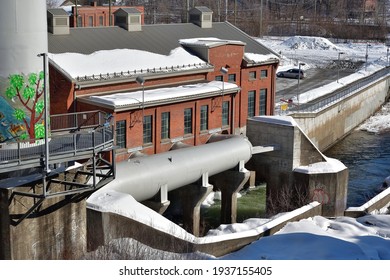 SHERBROOKE, QUEBEC, CANADA - March 4, 2021 : Magog River Hydroelectric Power Plant, Penstock, Renewable Energy