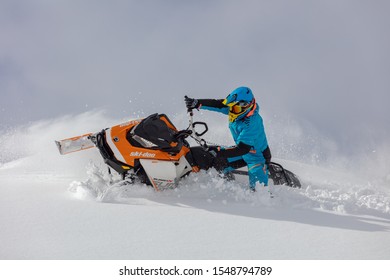 Sheregesh/siberia - 03/10/2019: tests snowmobile brp and equipment in extreme winter conditions in the forest. rider is doing jumps and turns with spray snow on a snowmobile - Shutterstock ID 1548794789