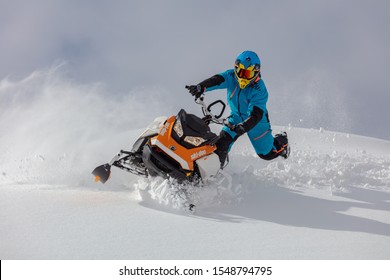 Sheregesh/siberia - 03/10/2019: tests snowmobile brp and equipment in extreme winter conditions in the forest. rider is doing jumps and turns with spray snow on a snowmobile - Shutterstock ID 1548794795