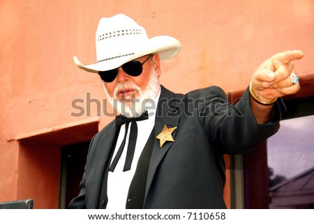 Sheriff pointing while holding a speech