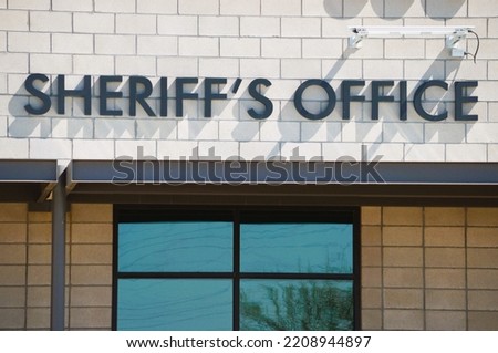 Sheriff 's Office lettering on building facade