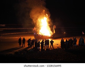 Sheringham, Norfolk / England - February 23 2019: Sheringham Viking Festival Torch-light Procession and Boat Burning on the beach.