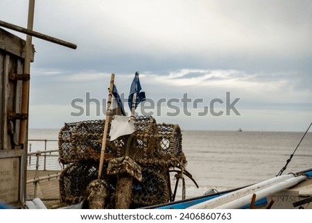 Sheringham, Norfolk, UK – December 29 2023. Crab pots, lobster pots and other fishing gear or equipment on the beach