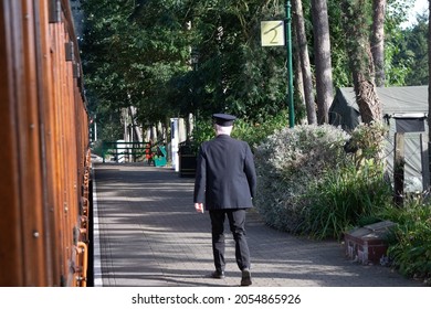 Sheringham, Norfolk, UK - SEPTEMBER 14 2019: Train Conductor Walks On Platform Durin 1940s Weekend