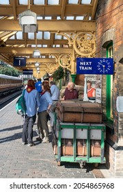 Sheringham, Norfolk, UK - SEPTEMBER 14 2019: People On Vintage Train Platform With Vintage Suitcases During 1940s Weekend