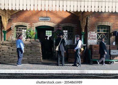 Sheringham, Norfolk, UK - SEPTEMBER 14 2019: People In 1940s Train Conductor Uniforms At Sheringham Train Platform During 1940s Weekend