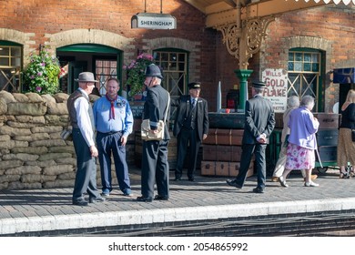 Sheringham, Norfolk, UK - SEPTEMBER 14 2019: People In 1940s Train Conductor Uniforms At Sheringham Train Platform During 1940s Weekend