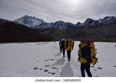 Sherpa Guides And Trekkers Are Trekking Across Lobuche Base Camp To Everest Base Camp, Khumjung,Nepal.