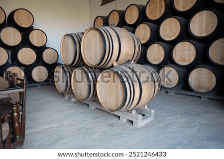 Sherry wine making process in Jerez triangle, Jerez de la Frontera, pile of oak barrels in wine cellars, solera system of aging sherry wine, Andalusia, Spain