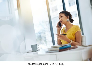 Shes Always Available And Eager To Talk Business. Shot Of A Young Designer Talking On A Cellphone While Working In An Office.