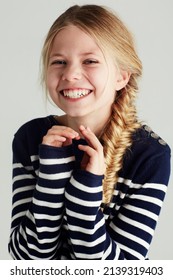 Shes So Cute And Carefree. Portrait Of A Cute Girl Giving You A Huge Smile.