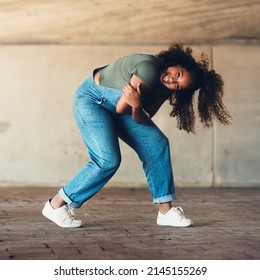 Shes Got All The Moves. Shot Of An Attractive Young Female Street Dancer Practising Out In The City.