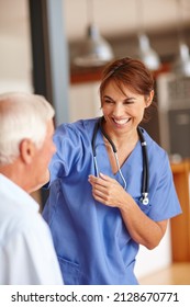 Shes Got An Excellent Bedside Manner. Cropped Shot Of A Female Nurse Checking On Her Senior Patient.