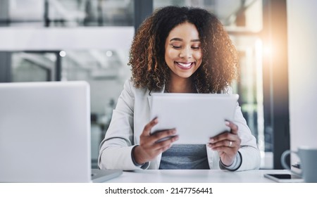 Shes Got The Tools To Bridge Over Any Business Boundaries. Shot Of A Young Businesswoman Using A Digital Tablet In An Office.