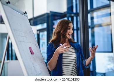 Shes Leading The Way Towards Prosperity. Cropped Shot Of A Young Creative Giving A Presentation To Her Colleagues In An Office.