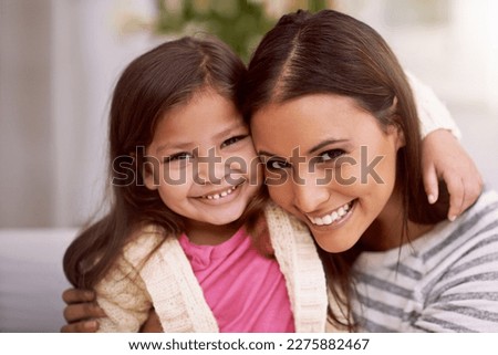 Shes my treasure for sure. Portrait of a mother and her little daughter spending quality time together at home.
