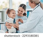 Shes not afraid to get her routine vaccine. a doctor using a cotton ball on a little girls arm while administering an injection in a clinic.