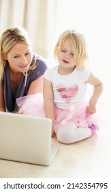 Shes A Quick Little Learner. Shot Of A Mother And Daughter Bonding While Surfing The Internet Together.