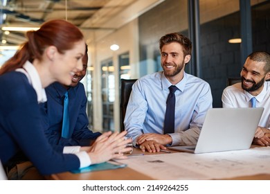 Shes Really Excited About This Project. Shot Of A Group Of Businesspeople Having A Meeting.