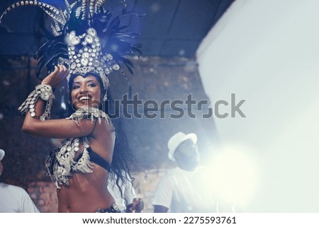 Shes a scintillating samba queen. a beautiful samba dancer performing in a carnival.
