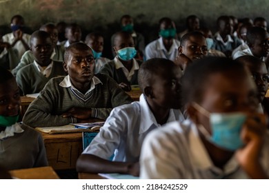 Shianda, Kenya - 07.21.2021: High School Students Wearing Masks And Sitting In A Biology Class In A Small Rural School In Kenyan Countryside.