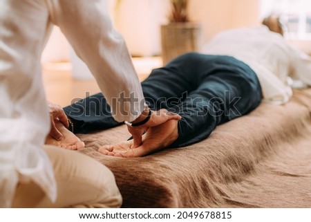 Shiatsu Foot Massage. Therapist massaging the kidney meridian.