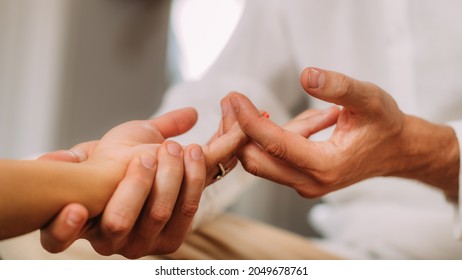 Shiatsu Hand Massage. Therapist Massaging The Heart Meridian.