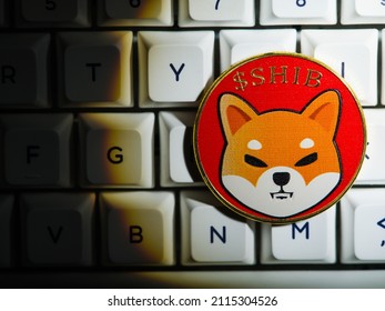 Shiba Inu - Cryptocoin On A White Computer Keyboard. Virtual Money, E-commerce, Cryptocurrency, Cryptography, Mining, Electronic And Computer Equipment, Cybersecurity, Engineering.