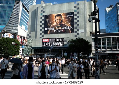 Shibuya, Tokyo, Japan - June 17 2021: Shibuya Scramble With A Billboard Of Marvel's 